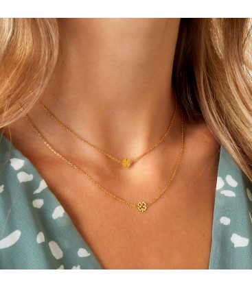 Goudkleurige ketting met een open klaver