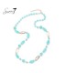 Halsketting met turquoise kralen en goudkleurige schakels
