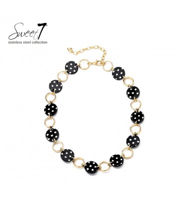Halsketting met zwarte polkadot schakels en goudkleurige ringen