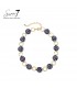 Halsketting donkerblauw met witte stippen en goudkleurige schakels